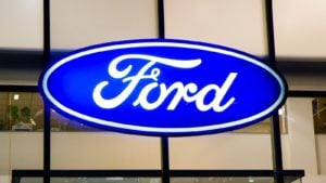 A Ford (F) sign hangs on a glass wall in Kiev, Ukraine.