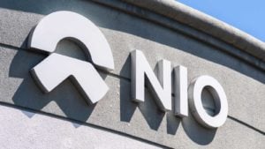 Image of Nio (NIO) logo branded on the exterior of a corporate building.