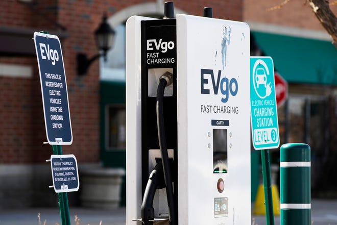A EVgo electric vehicle charging station is seen at Willow Festival shopping plaza parking lot in Northbrook, Ill., Wednesday, March 31, 2021. President Joe Biden's $2 trillion infrastructure plan includes a proposal to build a national network of 500,000 electric vehicle chargers by 2030 and replace 50,000 diesel public transit vehicles.