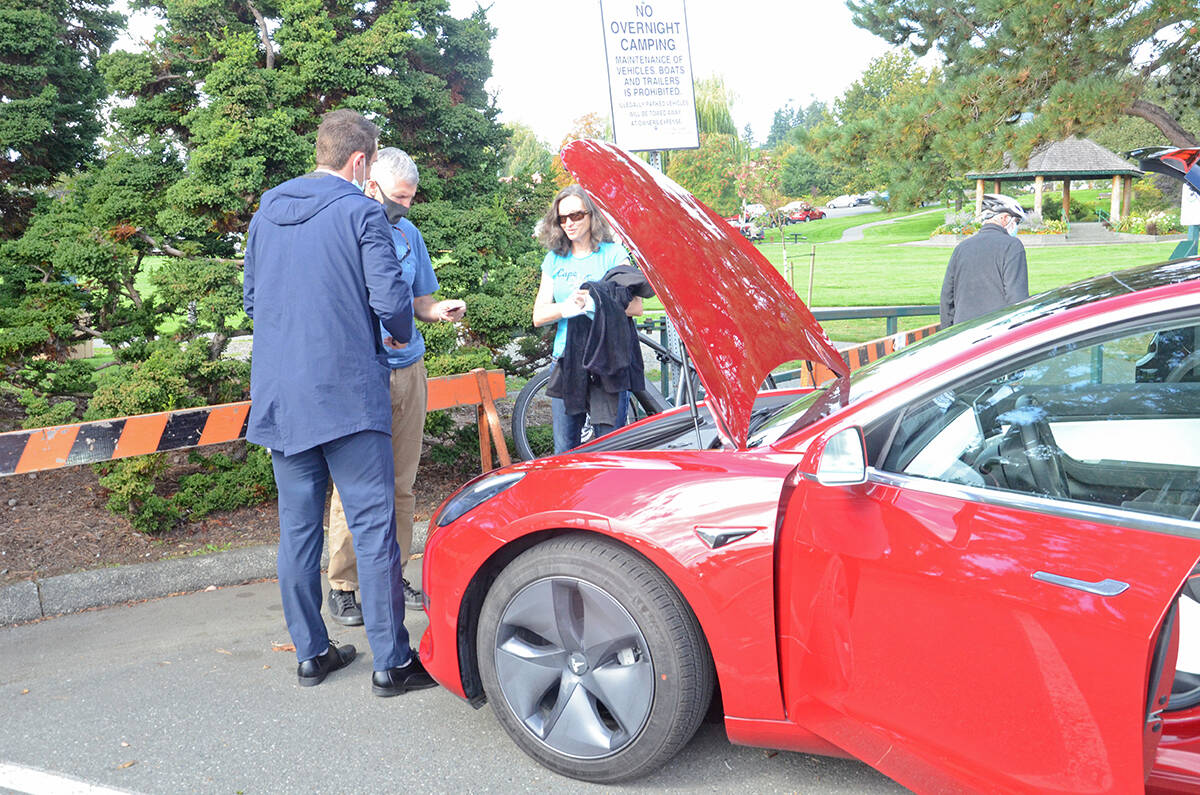Mark and Rosie Aisbett take a test drive in a Tesla. Photo by MIke Chouinard