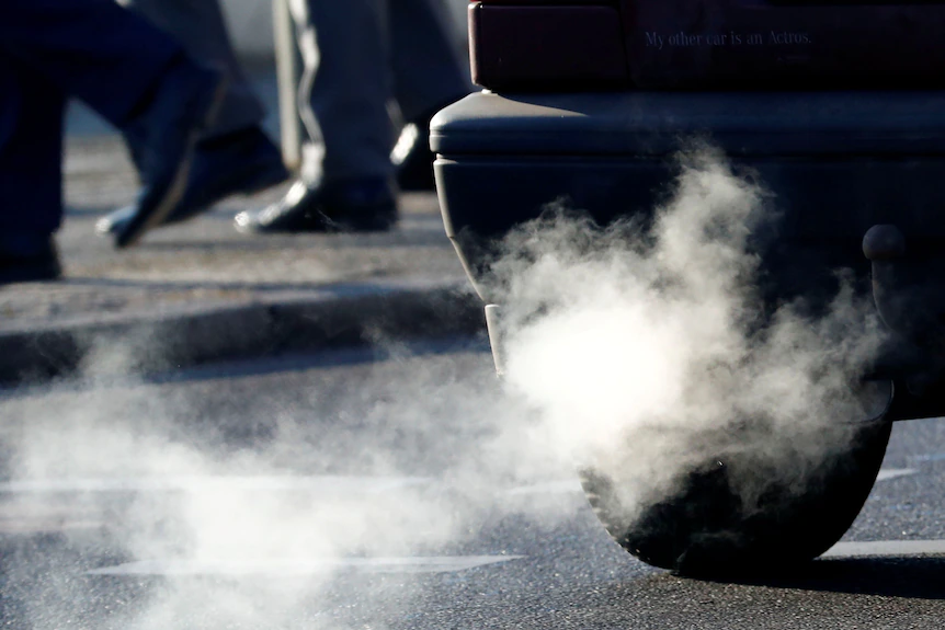 A car emits exhaust fumes