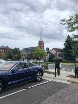 Patrick Anderson, CEO of Anderson Economic Group, drove from his home in East Lansing to Petoskey in his EV. Here he charges his car for an entire day in July 2020 at a public charger in Petoskey.