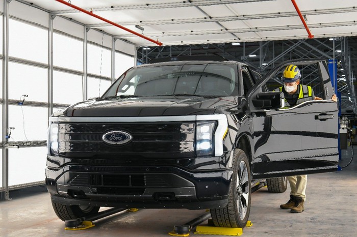 An electric Ford F-150 Lightning rolling down the production line.